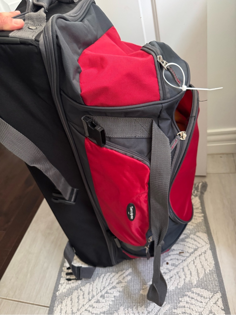Large Samsonite Red and gray wheeled  Duffel Bag